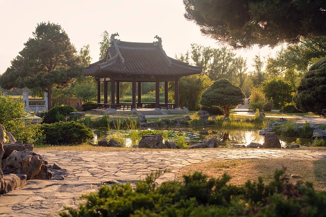 Sunlit pavilion by lake and stone path