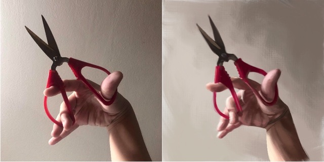 Holding a pair of scissors