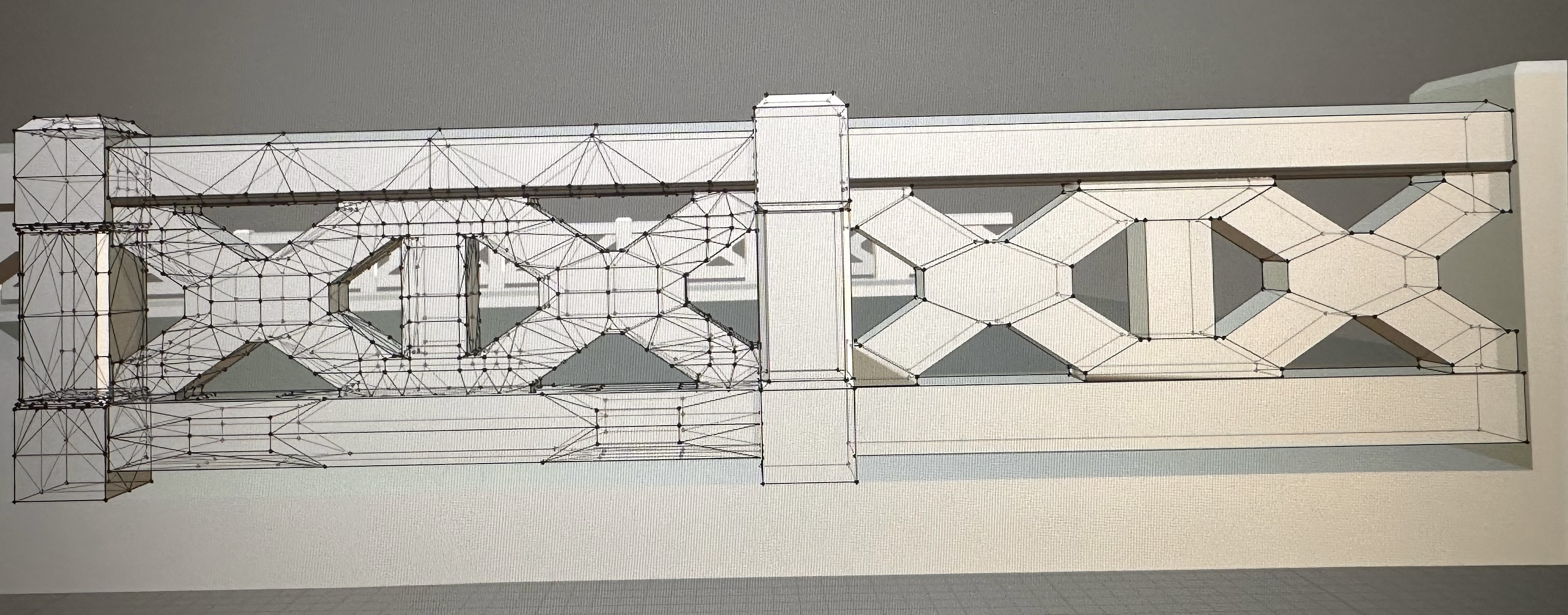 Retopologizing the bridge railings in Blender.
